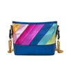 Topp axelväskor kurtg kvinnors designer handväskor väska kontrast färg skarvade regnbågskedja en crossbody tygväskor 240311