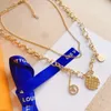 2024 Nytt lyxvarumärke hjärta hänge halsband guldpläterad enkel kärlek koppar ring logotyp tryckt designer halsband kvinnor designer smycken