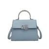 Butik design handväska grossist detaljhandel 2024 ny mode ljus lyx liten väska handväska hög fast färg axel kvinnor