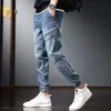 Pantalon de jeans pour hommes harem pantalon de cowboy masculin épissé pour les hommes cargo haruku baggy empilé par un denim original de style coréen