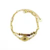 Brazalete Cadenas de acero inoxidable chapadas en oro de doble capa con forma de ojo natural Pulsera con colgante de piedra incrustada para mujer de moda 240319