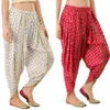 インドの絹のレディースタイのズボン。自由ho放なラップパンツ。青とピンクの花柄のペイズリープリントは、金の挿入物を備えています。