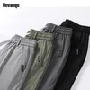Męskie spodnie unvanqu 2024 Summer Japońska moda mężczyźni Ice Silk Cienka Casual Street Młodzież Mała prosta elastyczna talia Mężczyzna