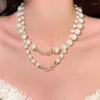 Collier de pierres précieuses enveloppées de chaînes, larme de sirène, perles de coquillages des profondeurs empilées