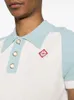 Nowy produkt Casablanca Men Designer Wełna Knitte Polos T-shirt Lose Color Blocked Perl Pearl Buttons Knit Polo Shirt Casual Versatile Pullover Sweater Casablanc