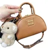 Grenzüberschreitende Großhandelshandtaschen der Modemarke New Home Bowling Handheld Gold Label Dumpling Bun Single Shoulder Skew Straddle Bag
