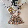 Brytyjskie sukienki w stylu British Girls Sukienki Summer Dzieci Lape Lapel krótkie rękawowe sukienka Preppy Style Kids Bawełniany projektant Stripe Ubrania S1228
