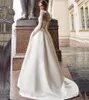 Blygsam långärmad bröllopsklänning 2020 Ny skopa satin applicerad aline brudklänning med fickor vestidos de novia 132729883