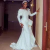 Aso Ebi Abito da sposa a sirena per la sposa Taglie forti Illusion Abiti da sposa Collo trasparente Perle Maniche lunghe Abiti da sposa per Africano Arabo Nigeria Donne nere Ragazze D178