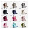 Top épaule Shoppers fourre-tout femme sacs Vintage seau nouveau sac de créateur mode printemps été sac à main 240311