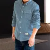 Chemises décontractées pour hommes American Retro Denim Bleu Blanc Chemise à manches longues à rayures verticales Bouton à la mode Vêtements masculins en vrac