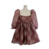 Women's four red plaid dress with square neckline, bubble sleeves, waistband, and fluffy skirt