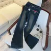 Jean femme Vintage américain bleu cloche bas taille haute poches déchirées jambe large Stretch Streetwear pantalon droit