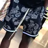 Pantalones cortos para hombres Verano Nuevos pantalones cortos de flores de anacardo Hombres de moda Hip-hop Suelto Casual Deporte al aire libre Baloncesto con cordones Cintura elástica Pantalón corto Y240320