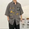 Męskie koszule Summer Men Men Hip Hop Harajuku koszulę Topy malowanie graffiti kolor streetwear luźne trend mody plaż hawajski