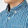 Chemises décontractées pour hommes American Retro Denim Bleu Blanc Chemise à manches longues à rayures verticales Bouton à la mode Vêtements masculins en vrac