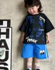 子供たちの印刷された服セットキッズタイ染料ハーフスリーブTシャツの目ストライプルーズショーツ2024サマーボーイズカジュアル服Z7242