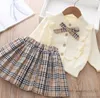 Preppy style Toddle kids clothes sets little girls plaid Bows tie knitted sweater cardigan lattice pleated skirt 2pcs INS children princess outfits Q8060