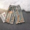 Kvinnors jeans koreanska version av personlighetshål Tassel denim shorts män och kvinnor trend 2024 japanska sommarbyxor lös