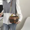 A fábrica vende bolsas de grife de marca on-line com 75% de desconto. Nova bolsa feminina fashion estampada estilo quadrado maquiagem de ombro