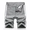 Jeans masculinos primavera verão casual rasgado perna reta moda shorts s 560 mens slim alto