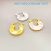 Créateur de bijoux de marque de luxe Western Empress Dowagerearring Xis Même style de boucles d'oreilles incrustées de coquillages pour femmes Cuivre Jaune Plaqué Or véritable 18 carats