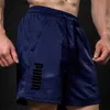 Pantaloncini da uomo 2024 Estate Nuovi pantaloncini sportivi da fitness Mens Gioco di basket Allenamento da corsa Pantaloni casual larghi ad asciugatura rapida a cinque punti Y240320