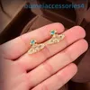 Pendientes de marca de lujo de diseñador para mujer, aretes de emperatriz occidental, estilo de cristal de Saturno, sencillos y versátiles