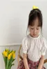 2020夏の韓国女の子ホロウアウトシャツガールコットンラウンドネックパフスリーブシャツトップスキッズ幼児ベビーベビーブラウスY20438451