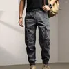 男性用パンツの男性固形色のズボン足首バンドデザインの貨物複数のポケットカジュアルスポーツ用の弾性ウエスト