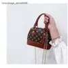 Fabrik säljer märkesdesignerhandväskor online på 75% rabatt små flickor skal väska mode kedja lutande utländsk stil liten barns handväska
