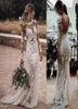 2021 Sexy Sheer Bohemian Sheath Wedding Dresses Jewel Neck Illusion Long Sleeves Lace Appliqued Crystal Beads Backless Beach Boho 1394960