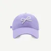 Ball Caps Koreańska wersja Pearl Bow Baseball Cap Wiosna wiosenna i letnia nisza słodka moda Słońca Regulowany sportowy kapelusz sportowy