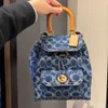 Balcão de alta qualidade luxo explosivo ombro moda saco novas mochilas Riya Mini mochila perfumada Bray Jacquard lona combinação de couro para mulheres saco