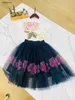 Nya babykläder Princess Dress Kids Tracksuits Storlek 90-150 cm Flower Print Girls T-shirt och perspektiv Lace Long Kjol 24mar