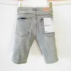 Paarse merkjeans Amerikaanse stijl met ruwe randen en gaten gewassen denim short heren