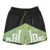 2024 Shorts designer Rhude Shorts Summer Beach Beach Men di alta qualità usura Street Street Pants Blue Black Purple Mens Short Us Size S-XL