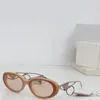 Occhiali da sole ovali piccoli di nuovo design alla moda 62WS aste in metallo con montatura in acetato occhiali di protezione UV400 per esterni stile semplice e popolare con ciondolo squisito