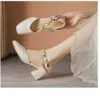 أعلى الصيف صندل مسطح أحذية رمال الكعب Hollow Sandals Women Stiletto High Heel Sandals 240228