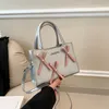 Borsa a tracolla di grande capacità con papillon argento alla moda