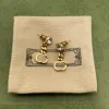 Orecchini a catena in cristallo lucido Lettere Charm Borchie con diamanti Designer Dangler Borchie lunghe catene dorate con gioielli firmati scatola