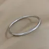 Bangle Klassieke roestvrijstalen effen cirkel glanzende armband voor vrouwen Eenvoudige klassieke stijl Dagelijks gebruik Manchet Polsband Sieraden Cadeau