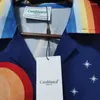 Polos para hombres Camisas de verano de primavera Letras de luna Graffiti Impreso Top Tee Hombres Mujeres Ropa Estilo de vacaciones hawaiano Camisa de manga larga