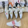 New men and women with the same new Europe and the United States flat-bottomed Joker platform leisure sports rivets small white shoes women.