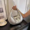 Bolsas de moda de marca de varejo por atacado Nova bolsa de bolinho de moda super quente com padrão de lichia brilhante Bolsa de ombro simples e personalizada