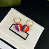 Boucles d'oreilles à charme en forme de cœur en forme de cœur