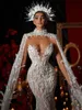 Utsökta fjäder bröllopsklänningar pärlor sjöjungfru brudklänningar se genom ärmlösa applikationer illusion skräddarsydd vestidos de novia
