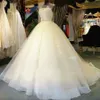 2024 Beautiful Ball Gown Sleeveless Tulle Wedding Dresses Illusion Neckline Appliques Elegnat Bridal Gowns Custom Made Court Train