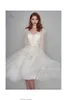 Długie rękawy Krótkie suknie ślubne Krótkie sukienki ślubne koronki V szyja A-line Low Back Women Nieformalna suknia ślubna z lat 60. XX wieku