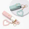 Aufbewahrungstaschen Lipgloss Schlüsselanhänger Stilvolle Lippenstifttasche mit Herzanhänger Kunstleder Minibehälter Hummerclip für Frauen